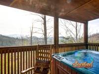 Hot tub with a  mountain view
